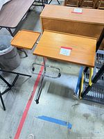 Full view showing wooden top and chrome rolling base