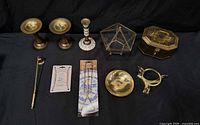 Group shot of all brass decor items and hardware