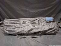 Chair stored in grey drawstring carry bag