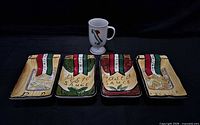 four rectangular trays and one mug grouped