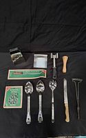 Full layout of all kitchen tools on black background