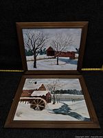 Both framed paintings side by side showing complete lot