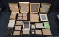 All 21 mixed metal frames laid out on black cloth