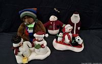 All five plush holiday figures grouped together