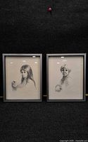 Both framed portraits side by side