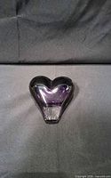 Front view of purple glass heart paperweight