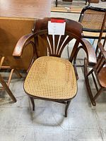 Top view of chair showing cane seat and bentwood arms