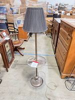 Full view of floor lamp showing shade, stem, tray, base, cord