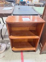 front view of wooden bookshelf with two shelves