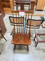 Front view showing overall design, seat, back spindles and armrests