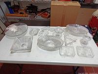All 17 clear ribbed Heisey glass pieces arranged on table