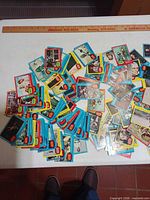 Spread of assorted vintage Star Wars trading cards on table