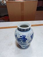 Front view of blue and white ceramic vase
