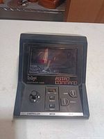Front view showing screen, controls and branding