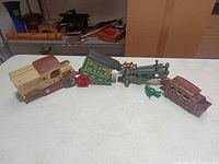 all four cast iron toys laid out