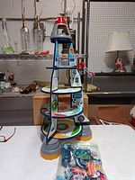 Front view of KidKraft rocket ship playset on table