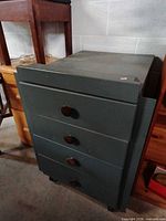 Front view showing four drawers and knobs