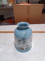Full view of vase front showing glaze and artwork
