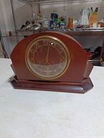 Front view of Seth Thomas mantel clock showing full case and dial
