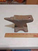 Side view of small anvil with ruler showing length