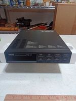 Front view of Yamaha FB-01 module in styrofoam