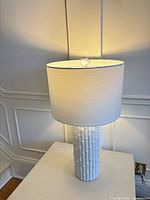 Front view of lamp showing full ceramic base and shade