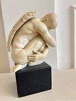 Full view of resin angel statue on base