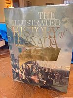 Front of a dust-jacketed book titled “The Illustrated History of Canada”