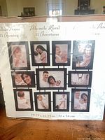 Box front showing collage frame design with 11 openings