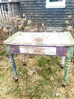 Front view showing drawer, paint wear and casters