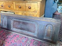 Full view of wooden piano panel showing overall size and decorative carving