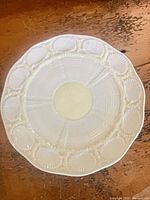 Front view of plate showing shell border and yellow lustre finish