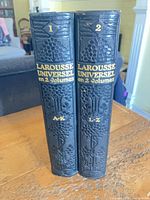 Spines of both volumes showing titles and volume numbers