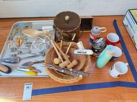 Overall lot on stainless tray with ice bucket, utensils, baskets, salt & pepper shakers