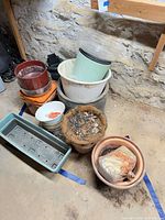 Grouped assorted planters, seed tray, coco liner basket, spare liner, hand tool