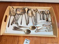 Overview of all flatware and serving pieces on tray