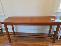Full view of teak console table front and side