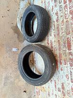 Both Continental tires side by side showing tread and lack of rims