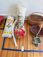 Overall view showing both batting rolls, two wicker baskets, small blue elephant planter