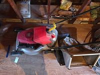 Top view of mower showing engine, deck and attached bag