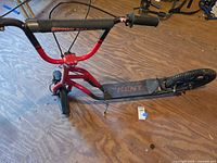 Overhead view showing entire scooter, deck branding, general wear