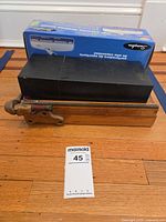 Group shot showing paper cutter, stamp kit box, and boxed desktop punch