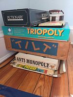 Stacked game boxes showing titles and box wear