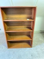 Front view showing four shelves and base