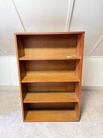 Front view showing four shelves and finish