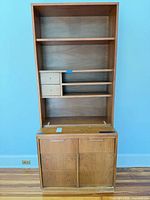 Front view showing dresser base and attached bookshelf