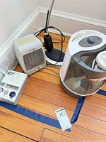 Group view showing heater, humidifier, lamp base, radio, cords