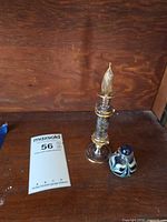 Lot overview showing both perfume bottles and size reference