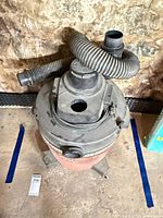 Overhead view of Shop-Vac showing hose, lid and overall condition