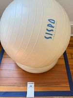 Cream SISPO stability ball on base ring